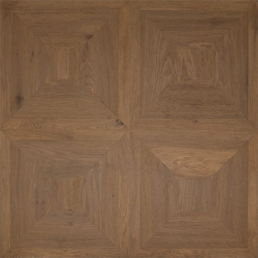 A square wood panel or flooring sample with a geometric parquet-style pattern in warm medium brown tones and visible wood grain.