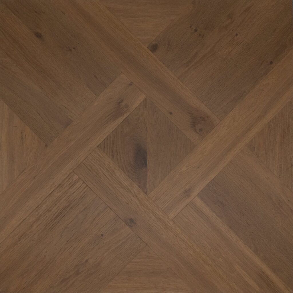 A square wooden panel featuring a geometric parquet-style design with concentric diamond and criss cross patterns in medium to dark brown wood tones.